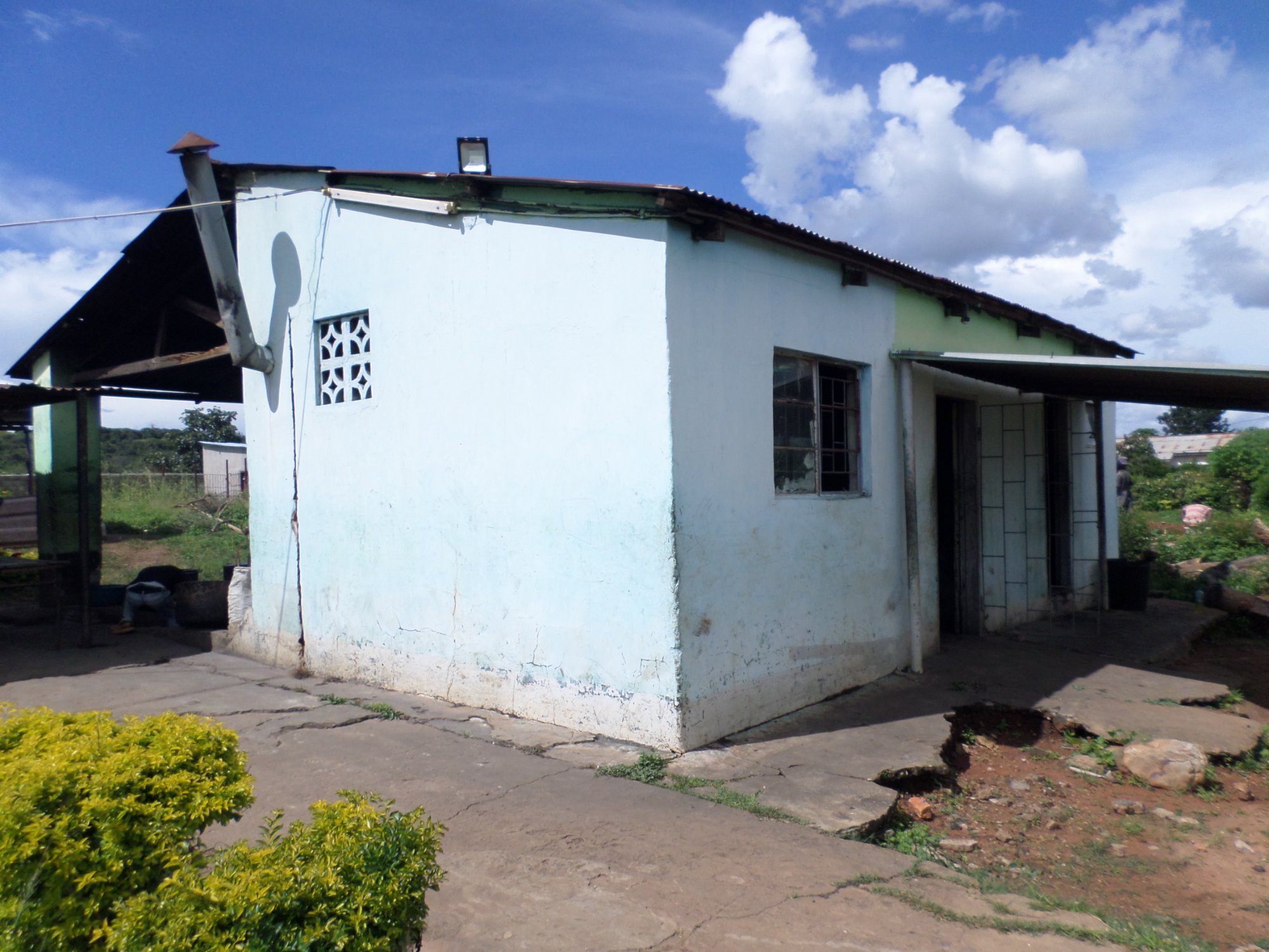 Exterior of kitchen block — crumbling walls