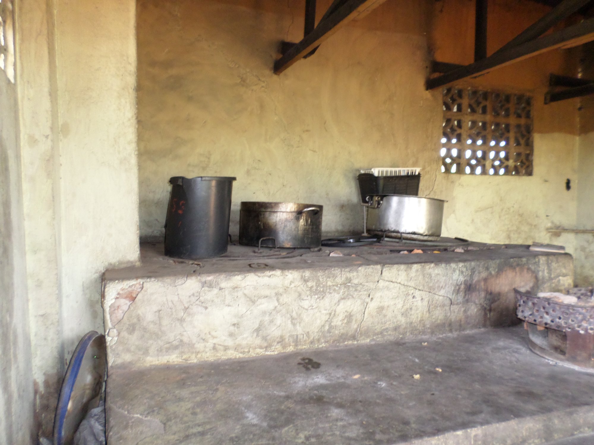Rusted stoves and blackened pots
